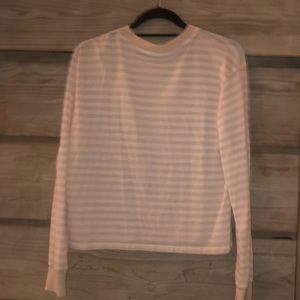 Long sleeve peach and white striped shirt.